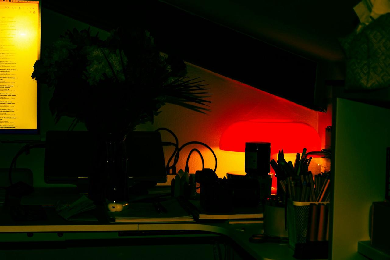 Creator workspace setup with colorful mood lighting, desk organization, and professional equipment